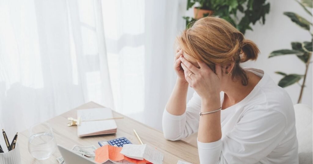 stressed lady on at her desk